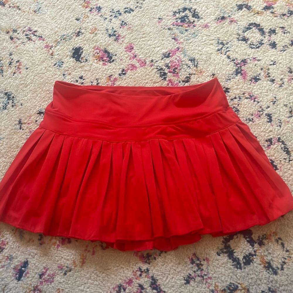 red gold hinge tennis skirt